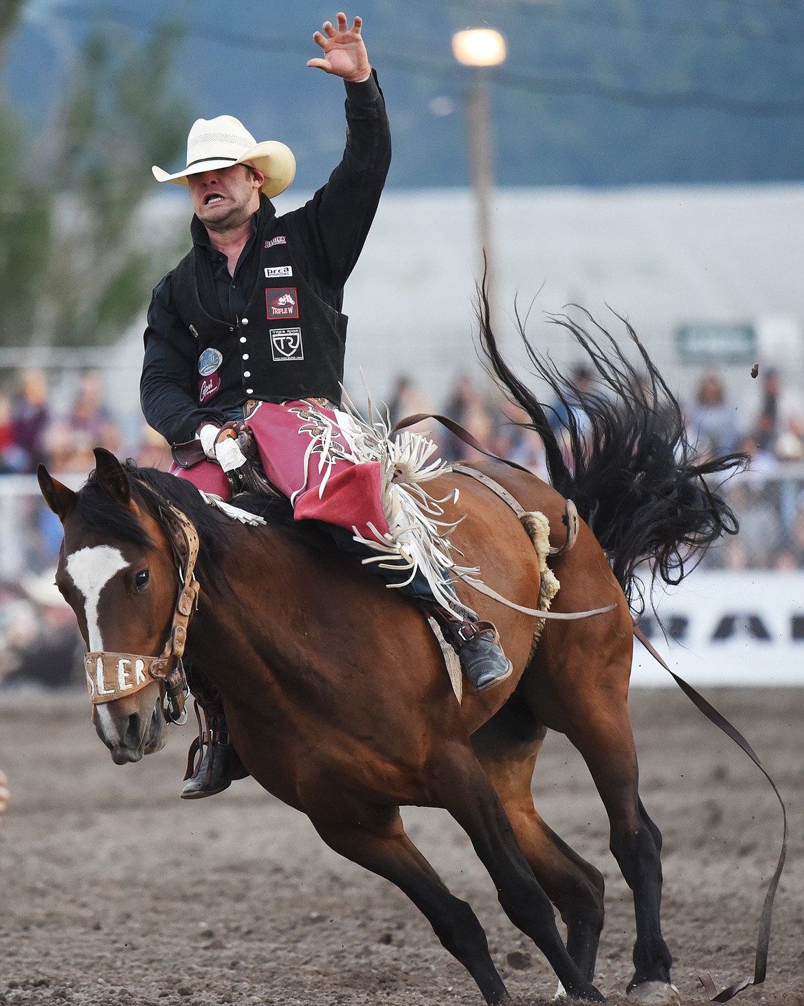 Wyatt Bloom, from Bozeman, holds on to his horse Mind Game during bareback riding at the Northwest Montana Fair PRCA Rodeo at the Flathead County Fairgrounds on Saturday. (Casey Kreider/Daily Inter Lake)