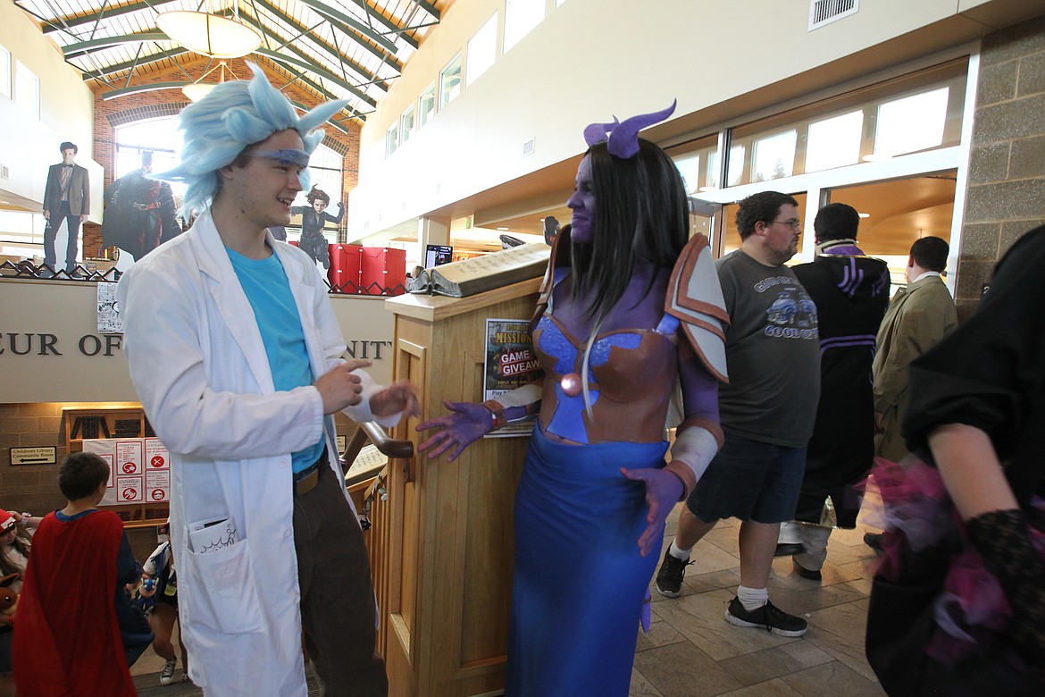 DEVIN HEILMAN/Press

Sean Spencer, 18, of Post Falls, is in full &#147;Rick&#148; character from the cartoon sitcom &#147;Rick and Morty&#148; as he shares a lighthearted moment with friend Sydney Morgan, 17, of Post Falls, during the Coeur d&#146;Alene Public Library&#146;s Coeur d&#146;Con in 2017. Sydney&#146;s cosplay character is a &#147;Draenei,&#148; a goat-like creature from the &#147;World of Warcraft&#148; role-playing game franchise.