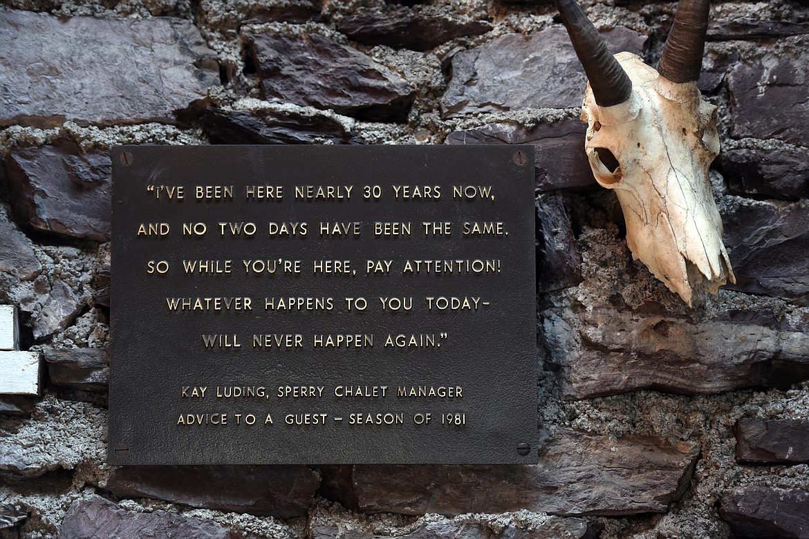 A sign and mountain goat skull posted near the doorway of the Sperry Chalet kitchen building on Thursday, Aug. 8. (Casey Kreider/Daily Inter Lake)