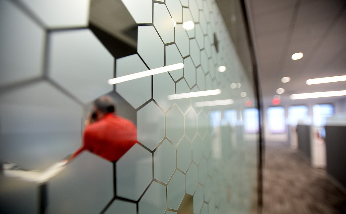 An Aon Edge employee uses one of the smaller conference rooms for a phone call on Thursday, August 15, at the new office in Kalispell.(Brenda Ahearn/Daily Inter Lake)