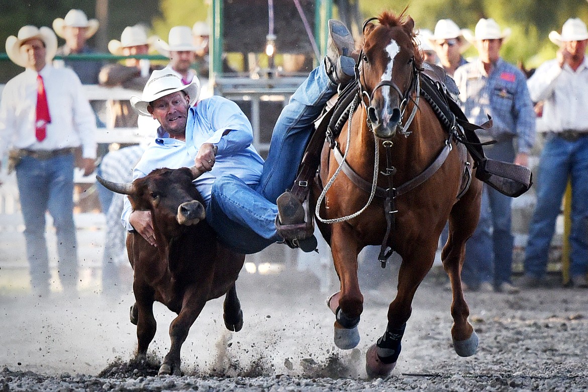Walt Anseth competes in steer wrestling at the Ram PRCA Rodeo at the Northwest Montana Fair &amp; Rodeo on Thursday. (Casey Kreider/Daily Inter Lake)