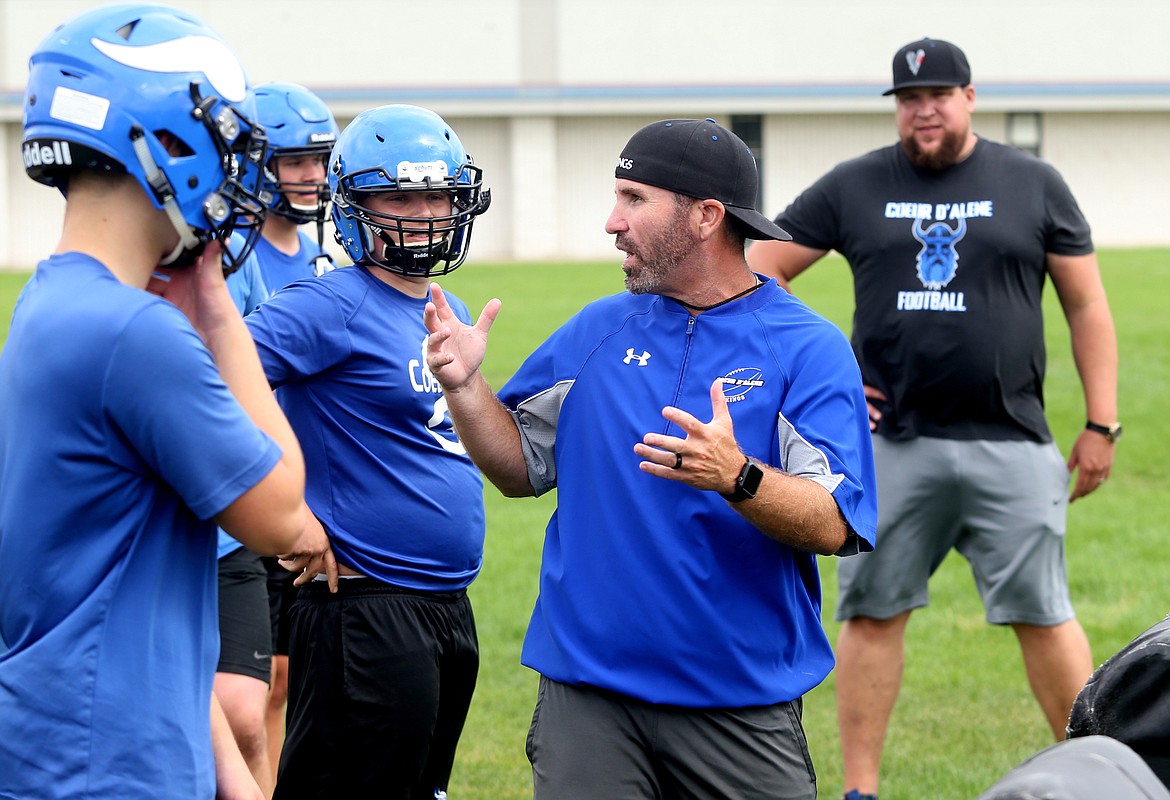 Coeur d&#146;Alene High School football coach Craig Shaver gives instructions to players during the first day of football practice on Monday. (LOREN BENOIT/Press)