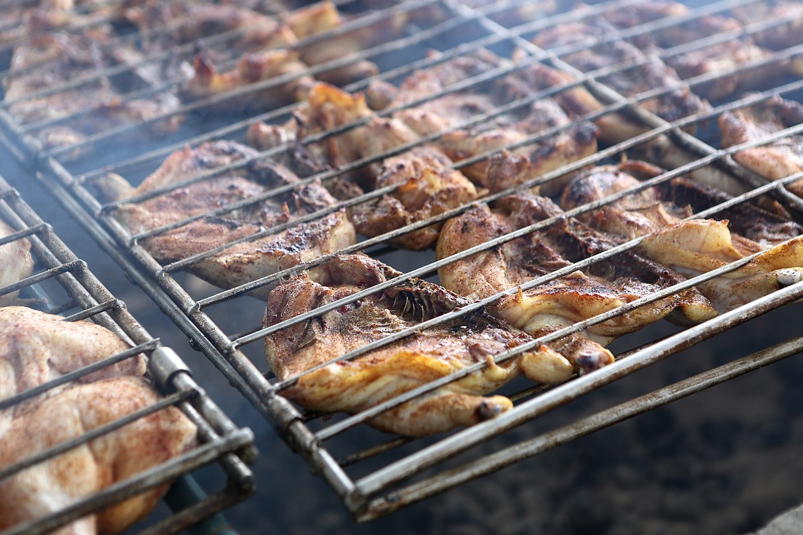 The Flathead Marines chicken dinner cooks on the barbecue pit. (Mackenzie Reiss/Daily Inter Lake file)