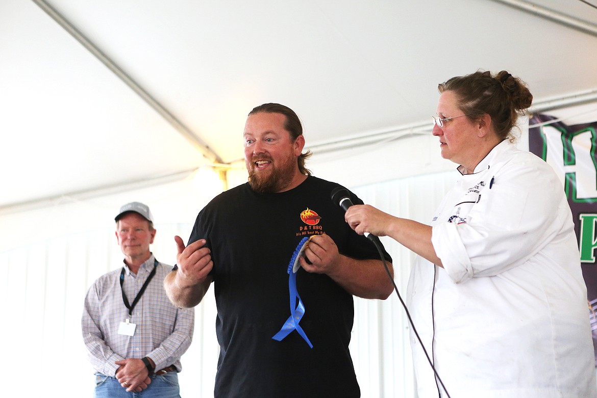 D&amp;T BBBQ owner Dave Wickwire is awarded the blue ribbon for best fair food at the Northwest Montana Fair on Wednesday. (Mackenzie Reiss/Daily Inter Lake)