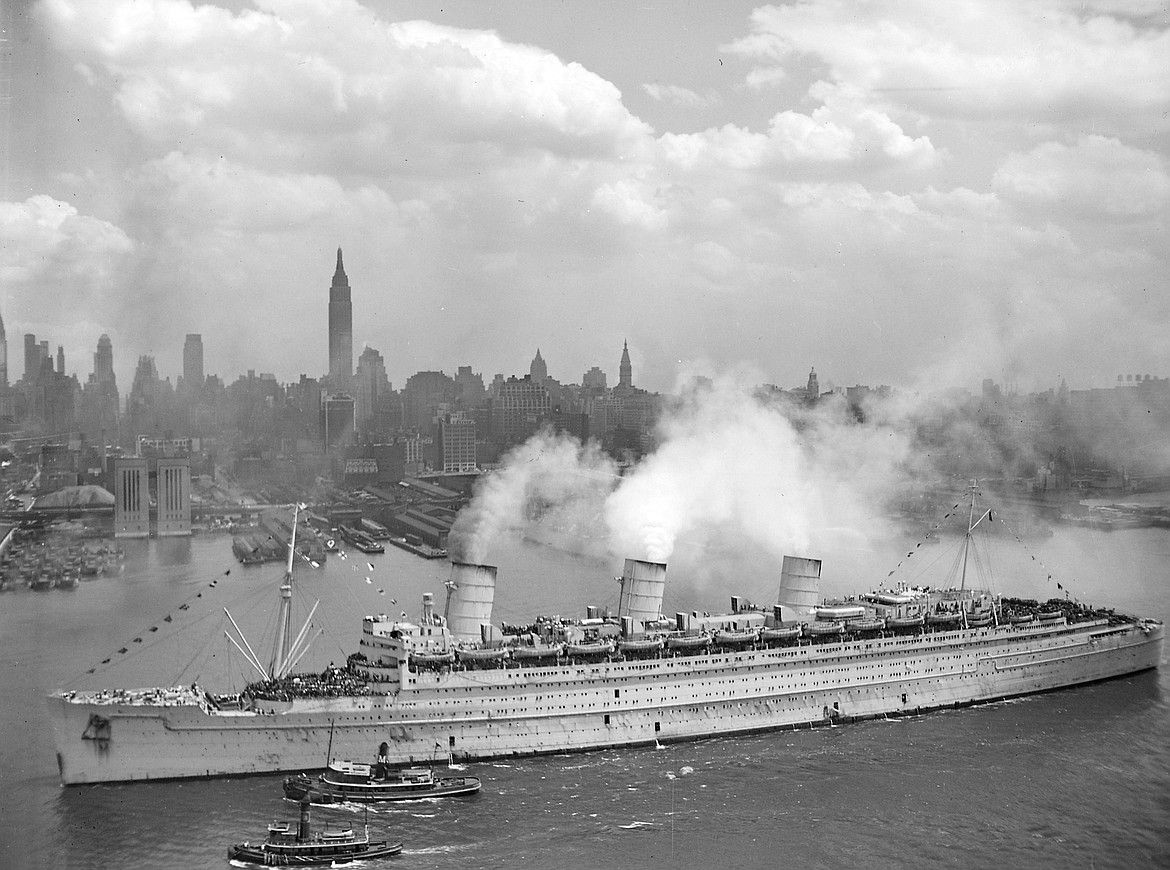 PUBLIC DOMAIN
RMS Queen Mary converted into a troopship entering New York Harbor on June 20, 1945, loaded with 16,683 troops after the end of World War II in Europe.