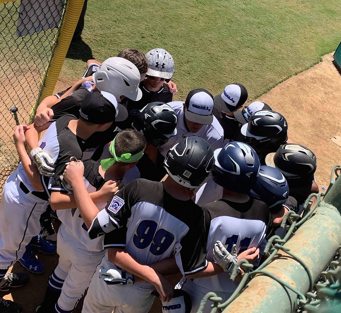 KALE FENTER/Special to the Press
Coeur d&#146;Alene Little League manager Robin Franklin, center, talks with his squad during Friday&#146;s Northwest Regional semifinal in San Bernardino, Calif.