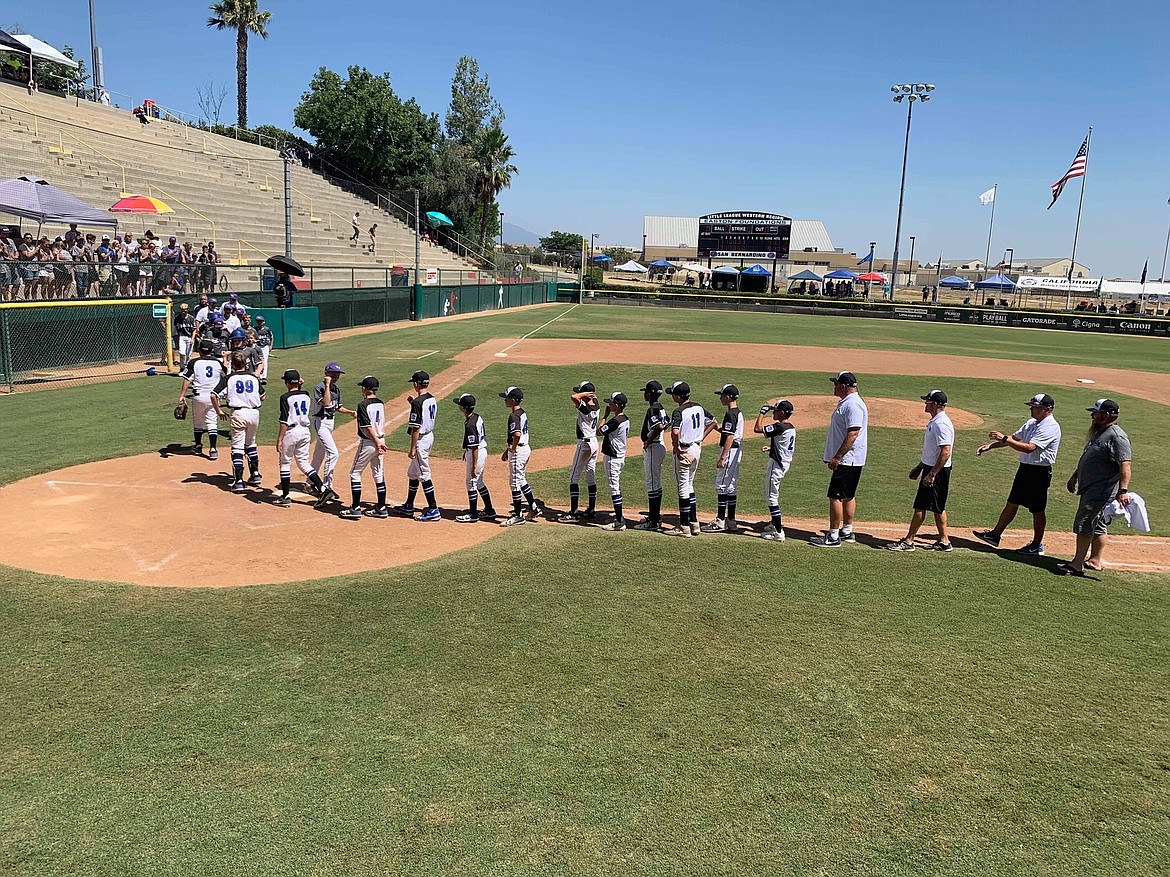 KALE FENTER/Special to the Press
Members of the Coeur d&#146;Alene Little League shake hands with Bothell following the Northwest Regional semifinal in San Bernardino, Calif. Coeur d&#146;Alene won the game 14-9 to advance to today&#146;s championship game against Salem, Ore., starting at noon on ESPN.