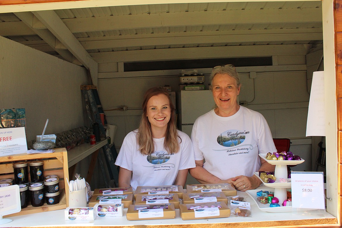JENNIFER ZAVALA and her mother Marilyn O&#146;Neill selling handmade chocolates at the Trout Creek Huckleberry Festival, in Trout Creek. (John Dowd/Clark Fork Valley Press)