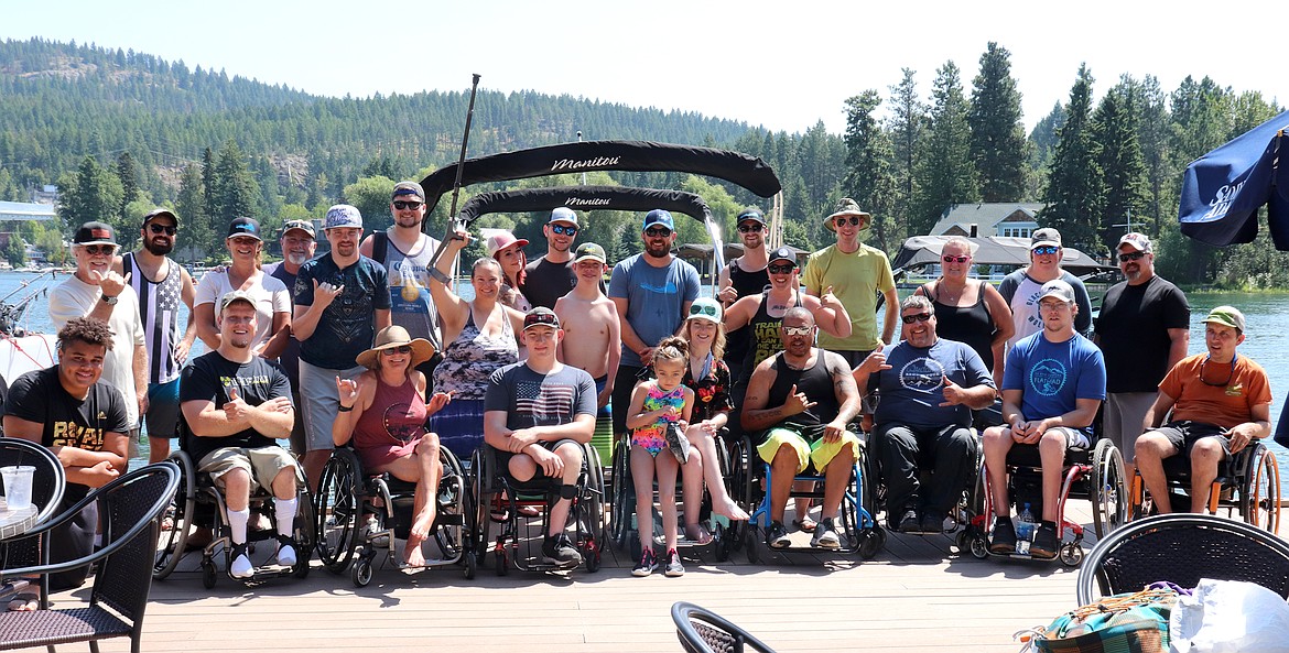 Participants in a watersports weekend organized by Moving Foward Adaptive Sports with help from Whitefish Marine pose for a photo on Flathead Lake. (Courtesy of Starla Hilliard-Barnes)