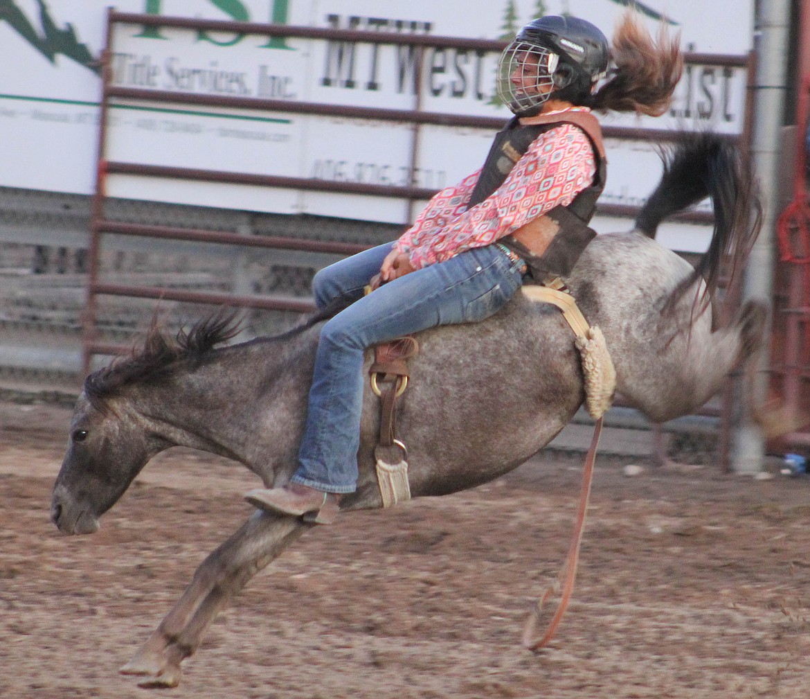 A rider stays on her pony at the Go For the Gold Rodeo on Saturday, August 3. (Maggie Dresser/Mineral Independent)