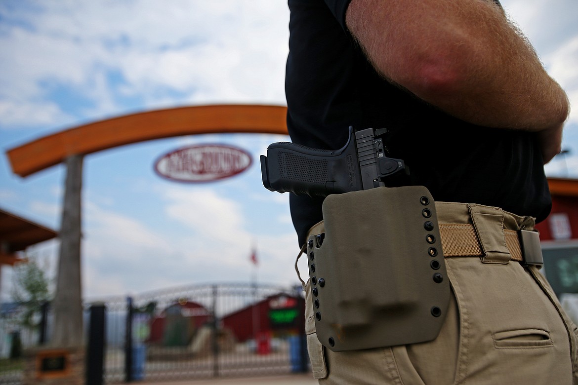 Idaho law allows for open carry at the North Idaho State Fair. Last year, more than 85,000 people attended the fair.  Of the five crowd incidents, none involved a firearm. (Photo Illustration by LOREN BENOIT/Press)