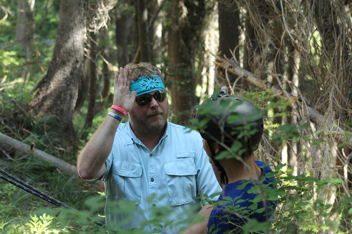 ROB CHRISTENSEN high-fiving Braxton Dorscher, one of the participants of the Project ASCENT youth camping programs, an Organization he started just a little more than. (John Dowd/Clark Fork Valley Press)