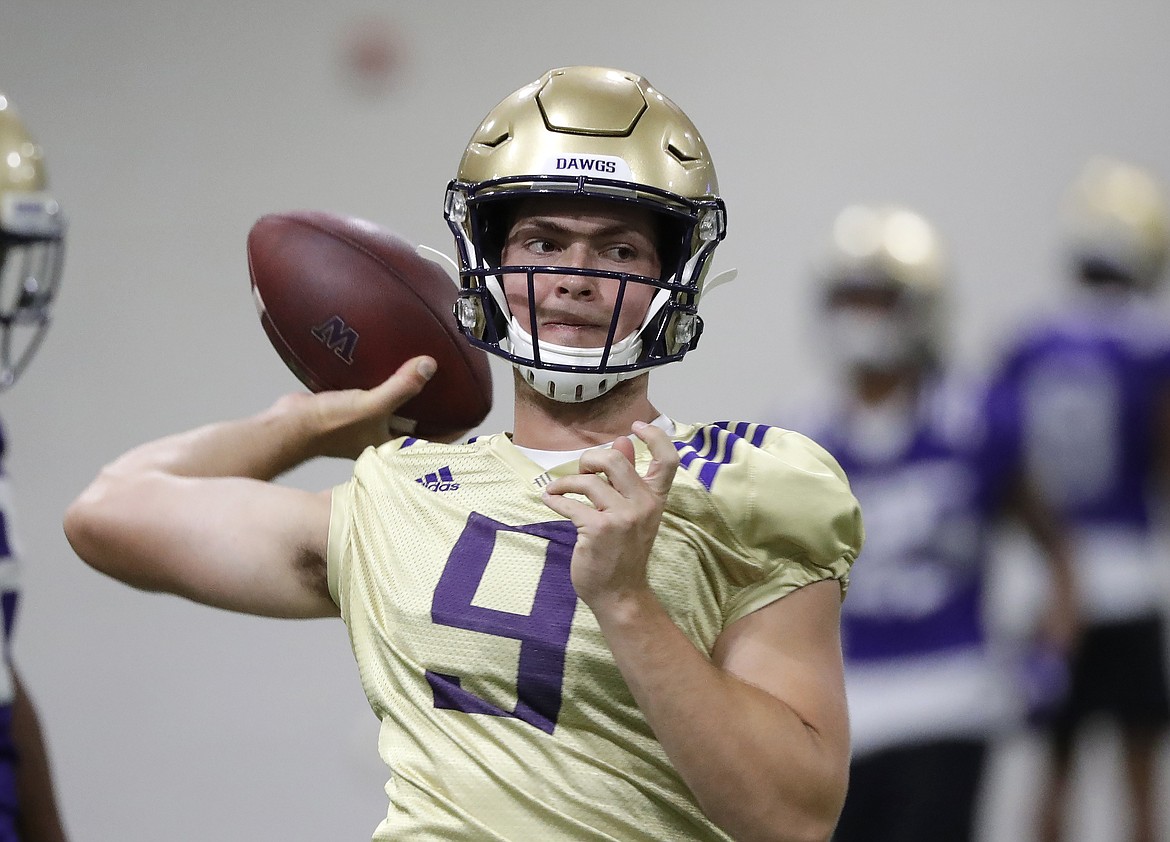 ELAINE THOMPSON/Associated Press
Jake Haener left the University of Washington football team over the weekend when he didn&#146;t win the starting quarterback job.