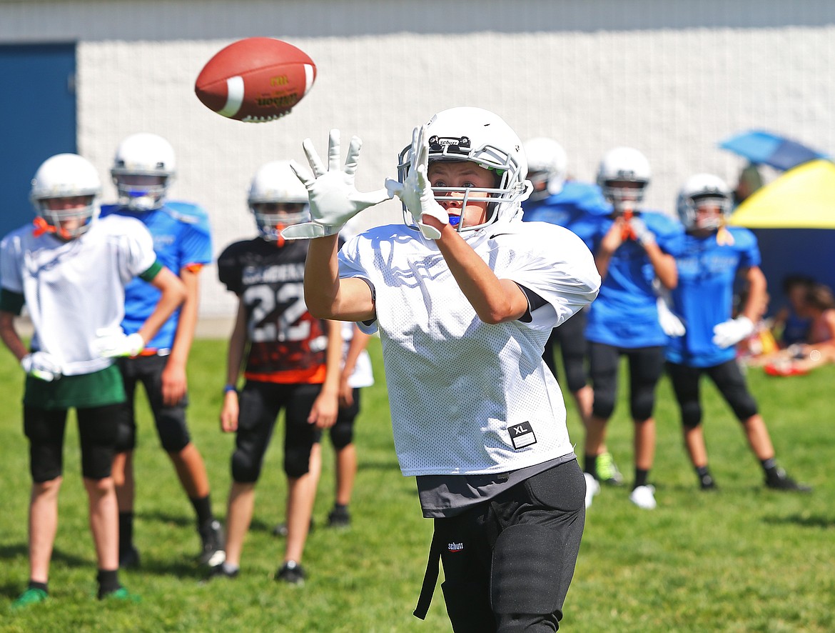 Dylan Gutich, a seventh-grade student at Canfield Middle School, participates in wide receiver drills during Coeur d&#146;Alene High School&#146;s Junior Tackle camp.