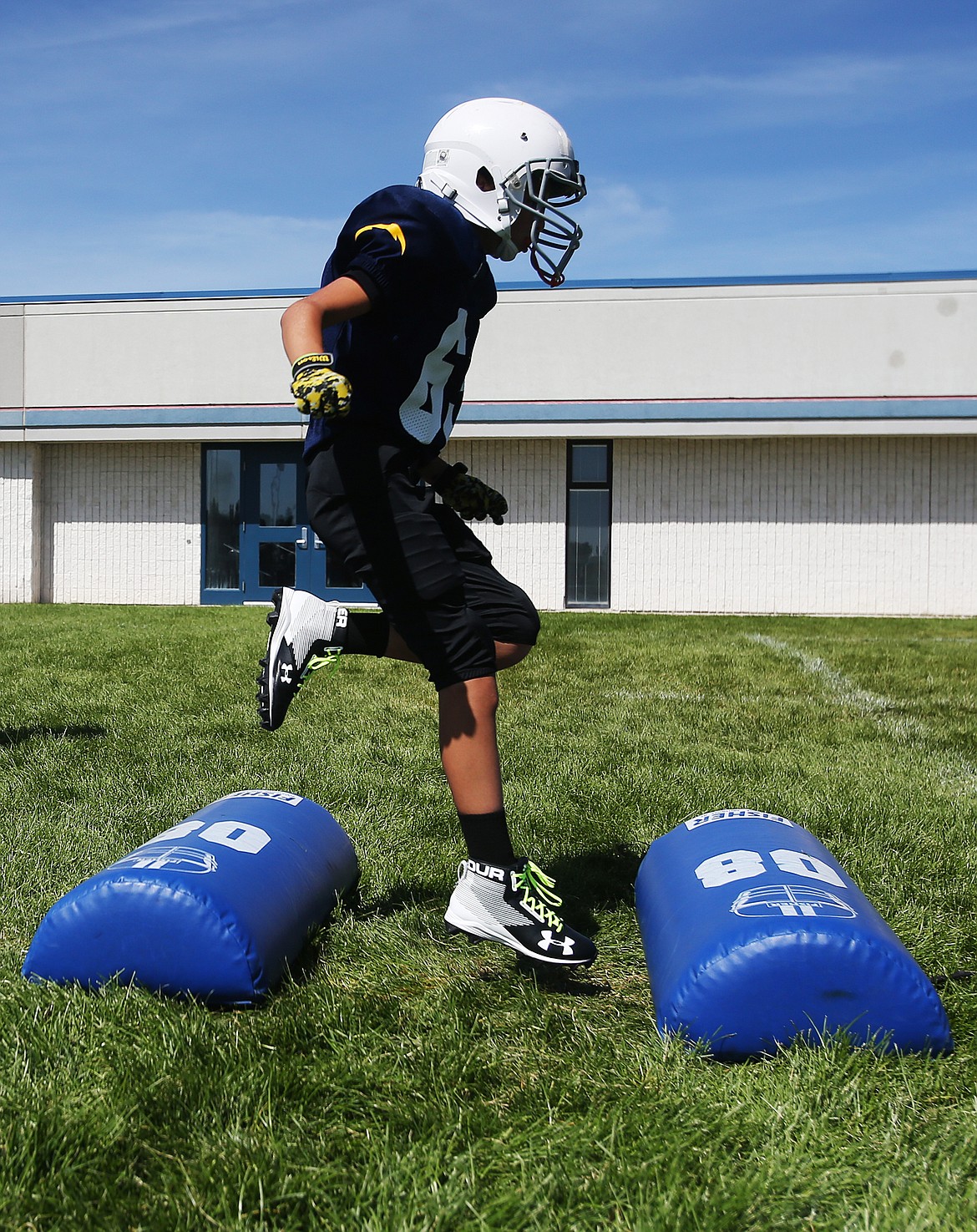 Thomas Taylor, a fifth-grade student at Dalton Elementary School, participates in agility drills at Coeur dAlene High Schools Junior Tackle camp.