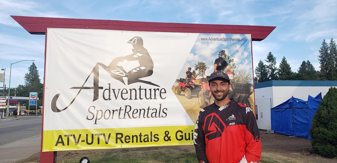 Courtesy photo
Ethan Naresh stands in front of the sign at Adventure SportRentals&#146; new location at 1902 E. Sherman