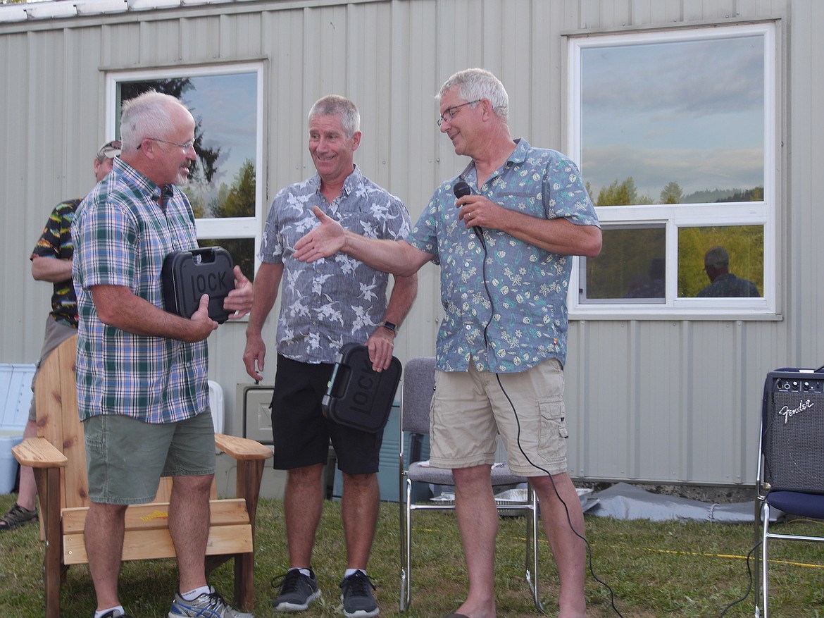 (Photo by DWAYNE PARSONS)
Idaho Fish &amp; Game Regional Enforcement Officer Craig Walker presents Tom Whalen and Rick Bogar with their service weapons in honor of their years of dedicated service. Idaho allows the awarding of service weapons to retiring law enforcement officers.