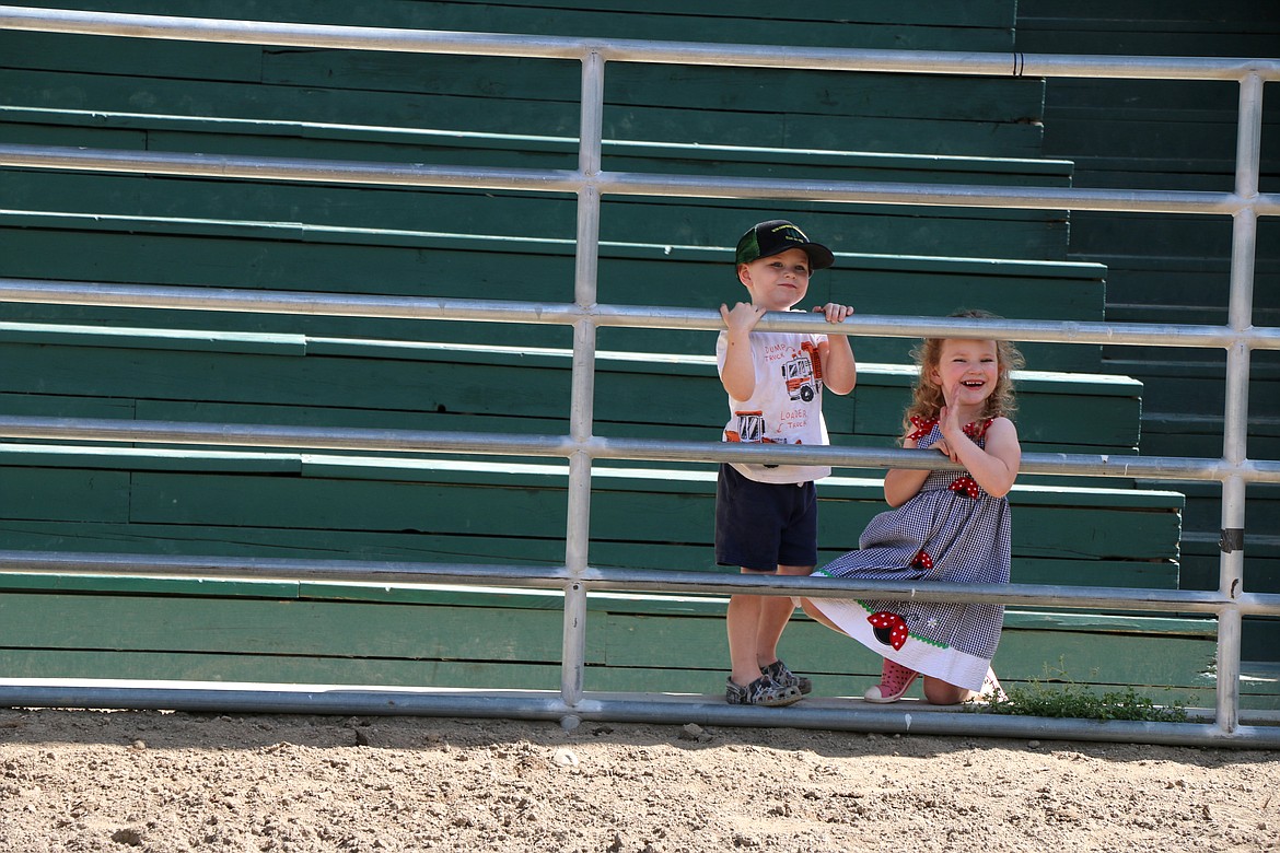 A young pair watch the Little Folks Horse Show from the grandstands at the Bonner County Fair Thursday.