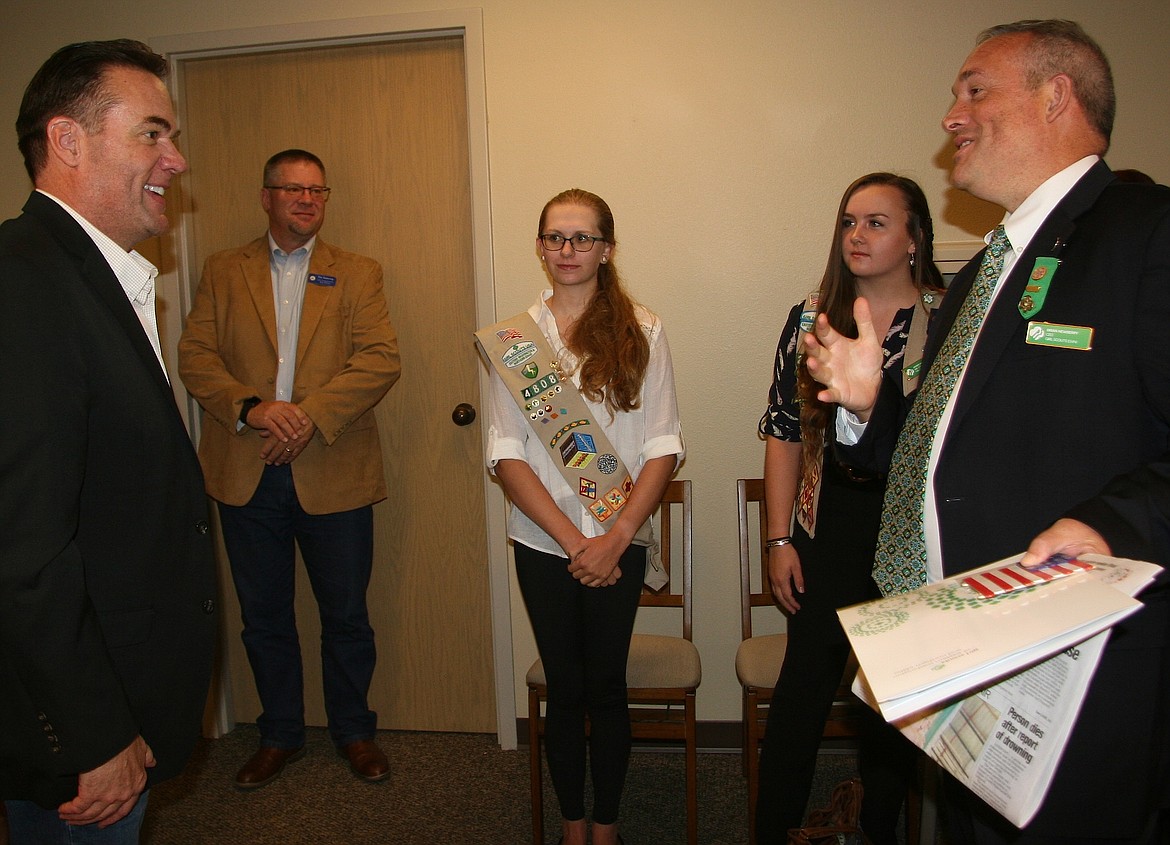 (BRIAN WALKER/Hagadone News Network)
Rep. Russ Fulcher, R-Idaho, left, visits with Brian Newberry, CEO of the Girl Scouts of Eastern Washington and Northern Idaho, on Thursday in Coeur d&#146;Alene. In the background from left are: Tim Kastning, Fulcher&#146;s North Idaho regional director, and Girl Scouts Caitlyn Smith and Jacquelyne Duncan.