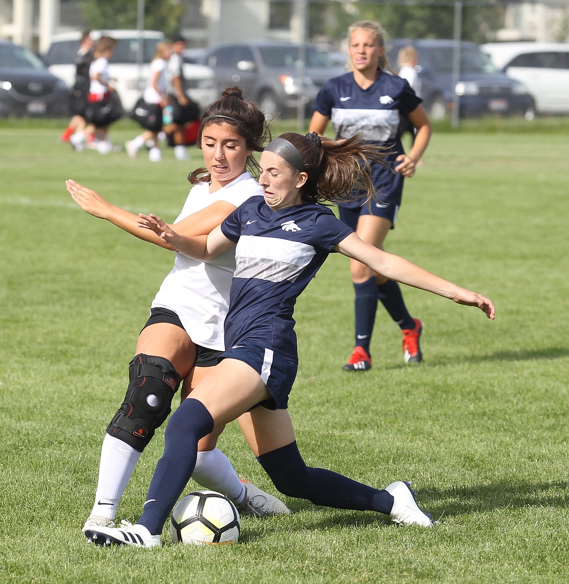 RIGHT: Lake City senior Madyson Smith, front, and Post Falls sophomore Kaylee Moate battle for possession during Wednesday&#146;s YEA jamboree at the Irma Anderl Soccer Complex.

JASON ELLIOTT/Press photos