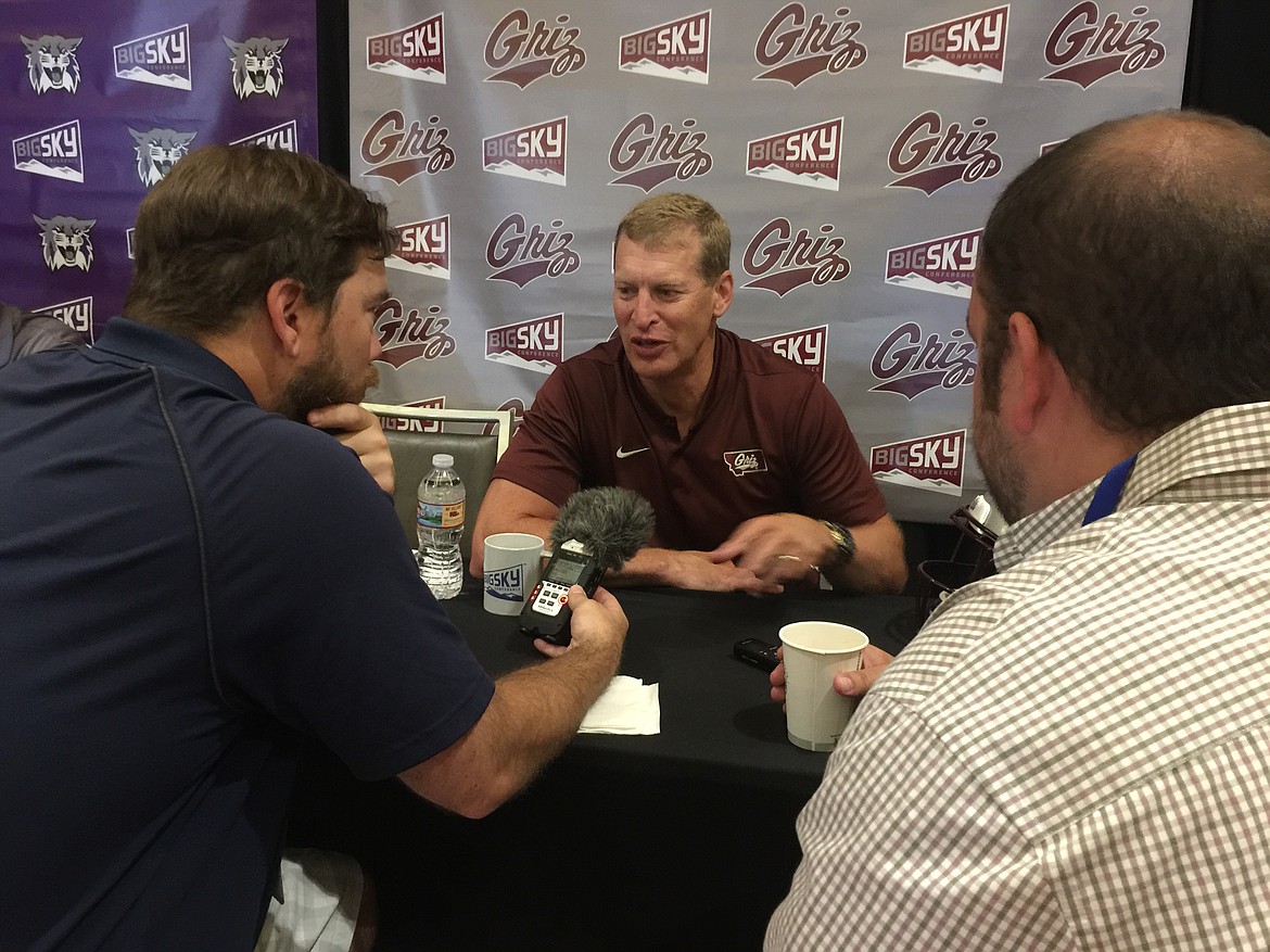 MARK NELKE/Press
Montana football coach Bobby Hauck chats with reporters at the Big Sky Kickoff last month in Spokane.