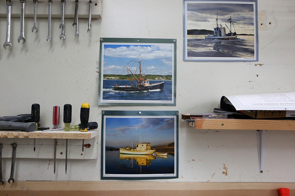 Photos of vintage wooden boats decorate the shop walls at the Montana Wooden Boat Foundation boat building center in Lakeside on Aug. 20. (Mackenzie Reiss/Daily Inter Lake)