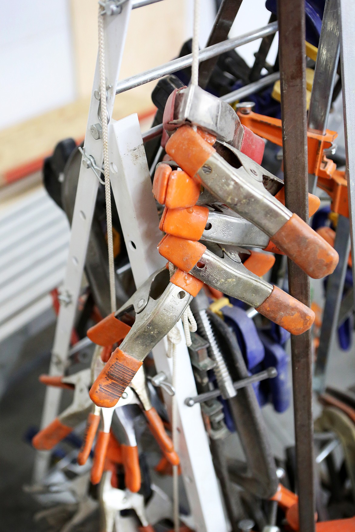 Scores of clamps fill a rack at the boat building center for the Montana Wooden Boat Foundation in Lakeside. (Mackenzie Reiss/Daily Inter Lake)