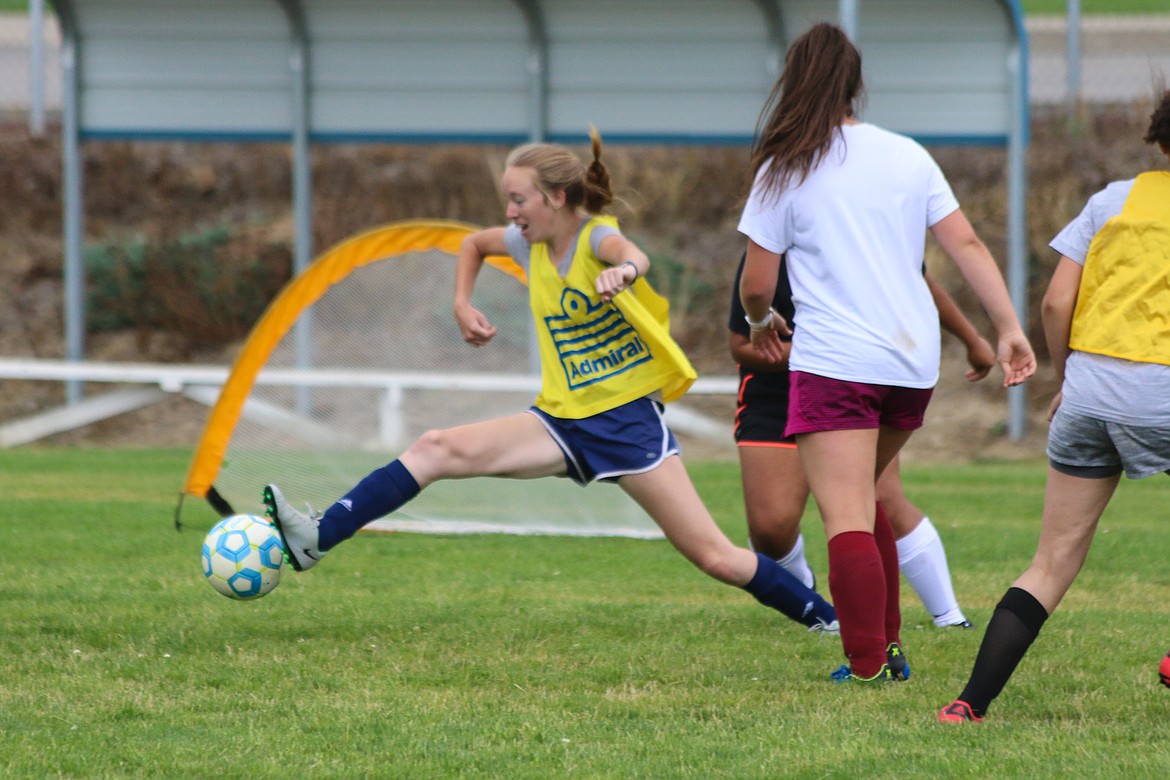 Rose Owens stretches to stop the ball.