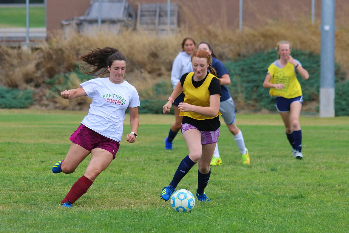 Photo by MANDI BATEMANLily Blackmore and Eika Willis practicing for the 2019 soccer season.