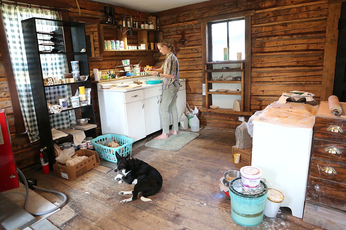 Fuson works inside her studio in Trego in the company of her dog, Byrdy.