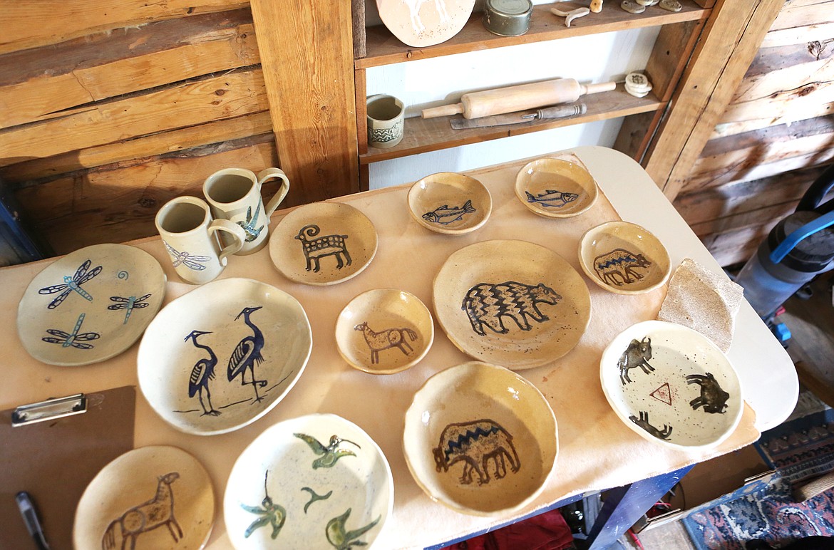 A display of pottery bound for the Hockaday Museum of Art in Kalispell covers a table at Casey Fuson&#146;s studio on Aug. 15. (Mackenzie Reiss/Daily Inter Lake)