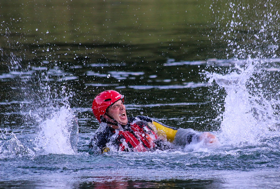 Photo by MANDI BATEMAN
Boundary Search and Dive Rescue Commander Tony Jeppesen plays the part of a victim in the Kootenai River during a rescue training exercise on Thursday, Aug. 22. North Bench Fire, Boundary Search and Dive Rescue, and Boundary Ambulance personnel met at the Twin Rivers Resort to practice basic water safety and throw bag training. For a story on the training, see page A2.