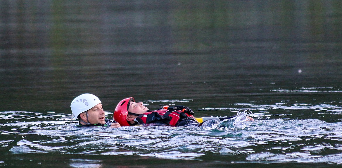 Boundary Search and Dive Rescue Vice Commander Pat Bennett on the left, in a scenario where Tony Jeppesen played the part of an unconscious victim.