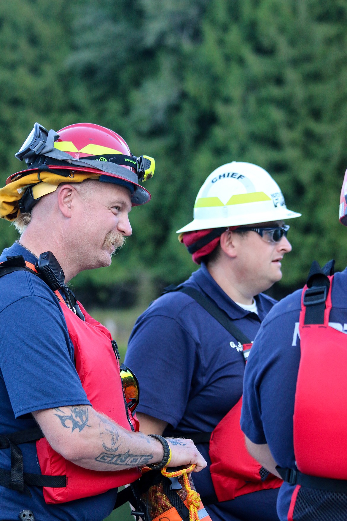 Photo by MANDI BATEMAN
North Bench Firefighter Tom Chaney and North Bench Fire Chief Gus Jackson during the water rescue training.