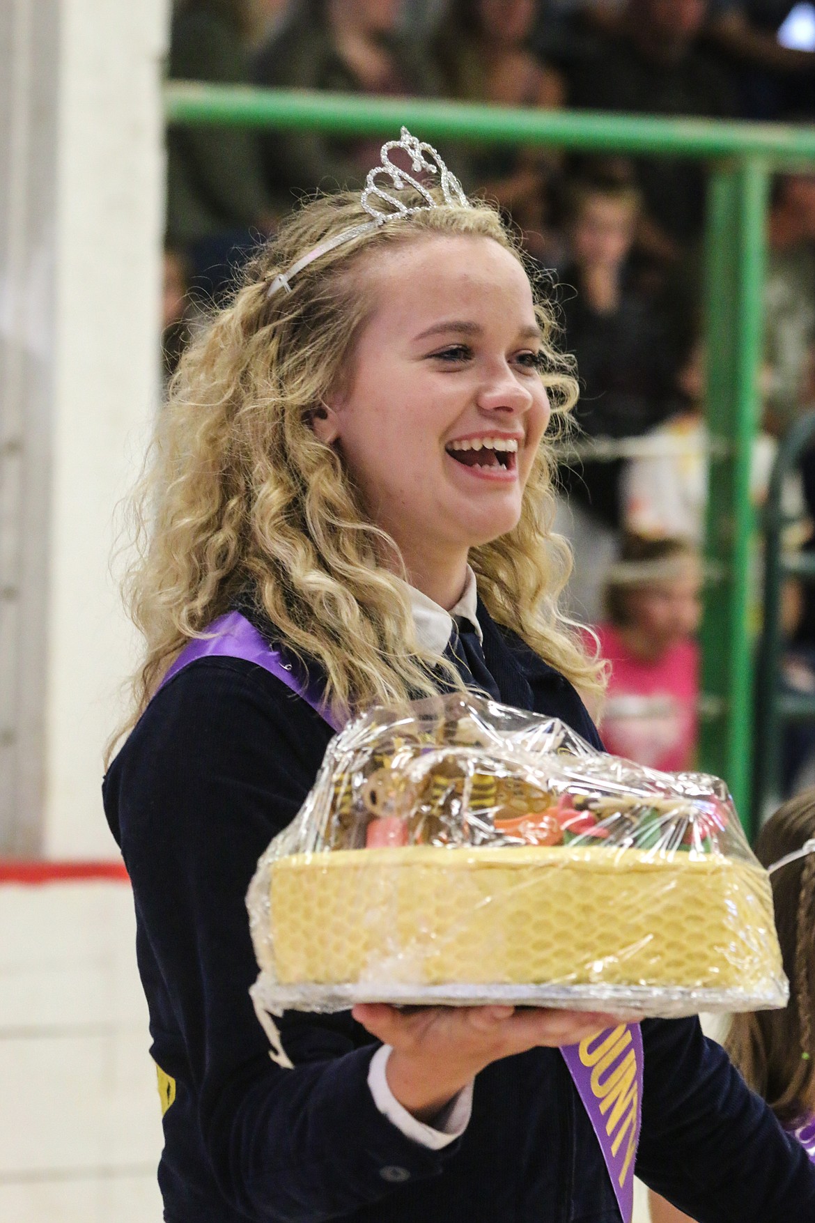 Photo by MANDI BATEMANPrincess Sydnee Blevins helps to acution off baked goods.