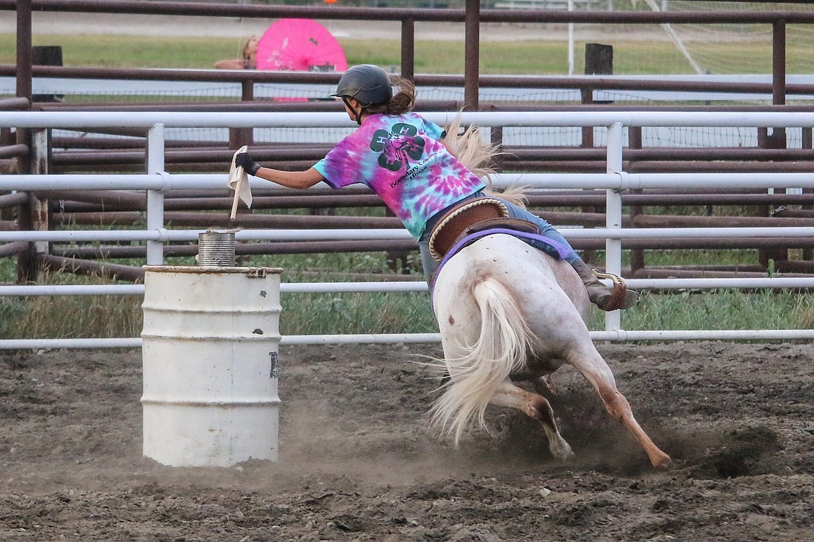 Photo by MANDI BATEMANOne of the fastest grabs of the flag was made by the rider on her POA pony.