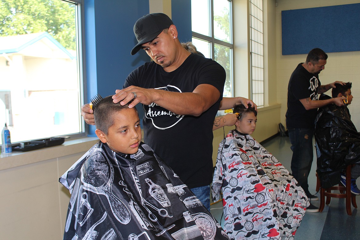 Cheryl Schweizer/For The Sun Tribune
Not only could kids get school supplies during the Back 2 School event, but they could get snazzy haircuts as well.