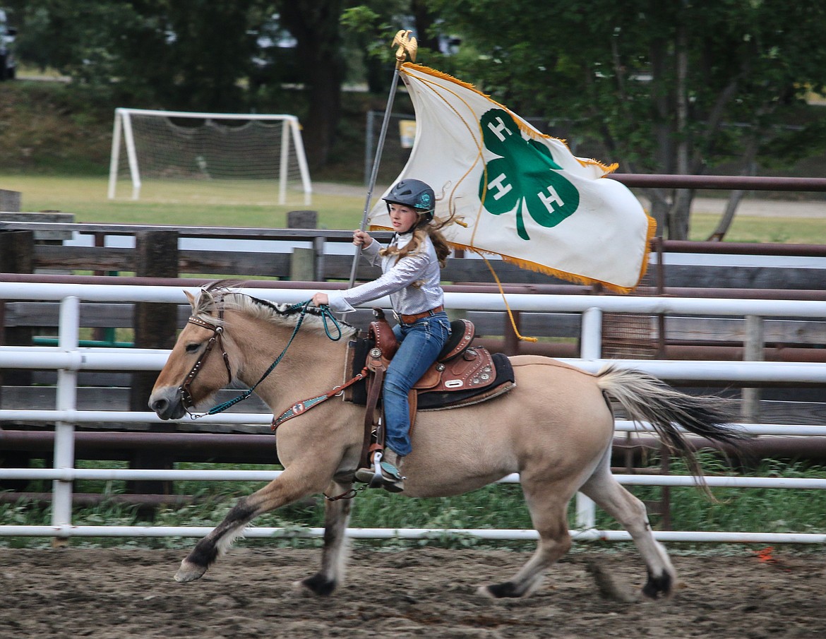Photo by MANDI BATEMANThe 4-H Flag making the rounds in the beginning of Family Fun Night.