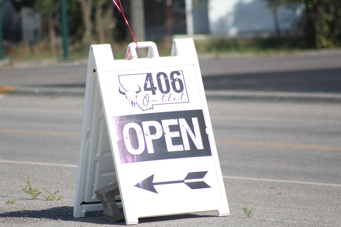 THE OPEN sign for 406 Outlet, last Wednesday at their grand opening. (John Dowd/ Clark Fork Valley Press)