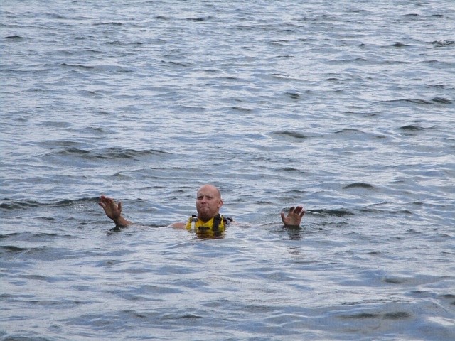 SCENARIO ROLE player and member Alex Brown acts as a stranded swimmer as 
member Stephanie Saint rescues him by tossing him a throw bag and 
bringing him to the boat. (Photo credit Shelly Rummell/ Clark Fork Velley Press)