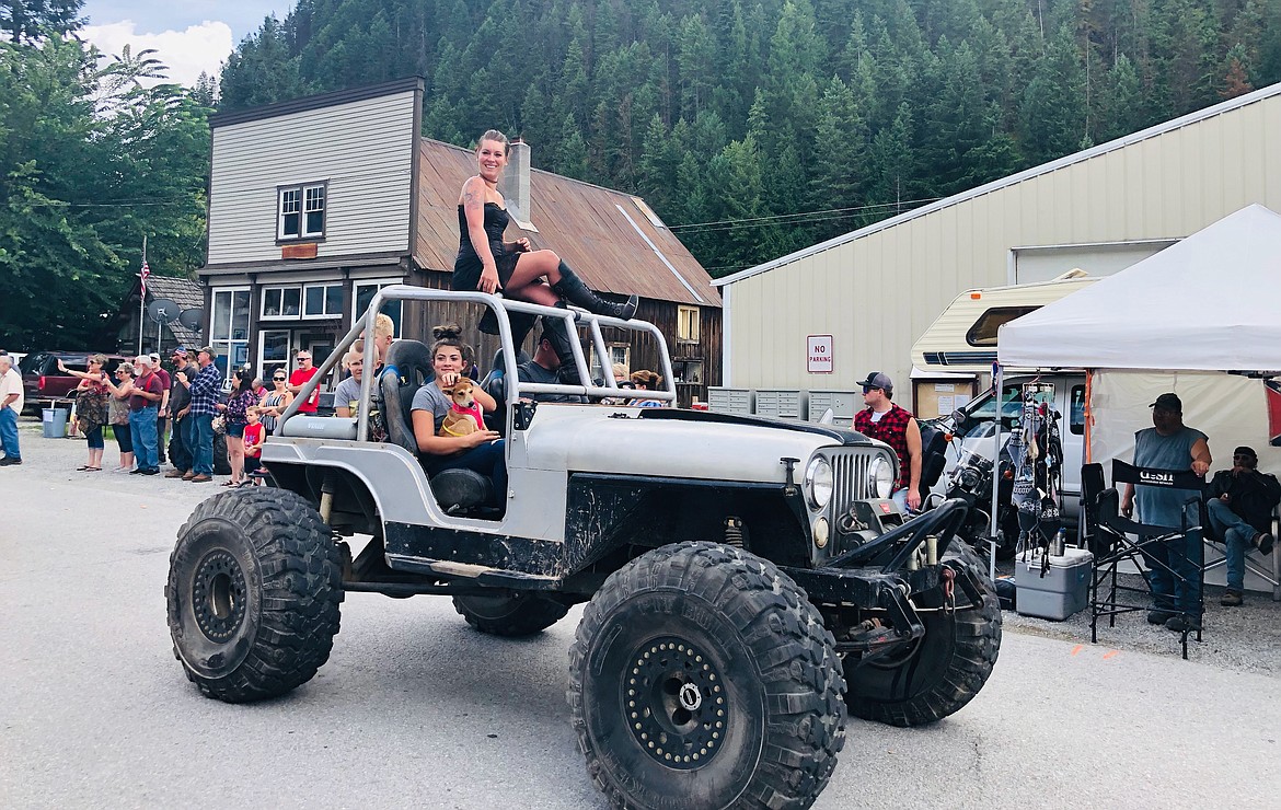 Photo by JOSH MCDONALD
Molly Queen candidate RayAnn Davis rides atop a Jeep during the Molly B&#146;Damn Days Parade.