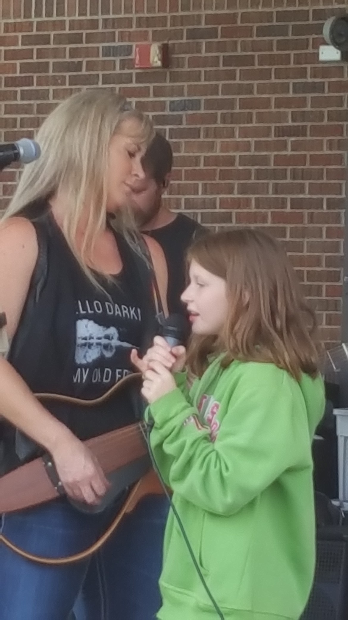 Story sings along side her mom during the concert. As an alumni of St. Regis, Jacque Jolene stressed to the students in attendance that you can follow your goals and dreams if you work to overcome the barriers in your way. Music was one of her dreams that she made a reality. (Courtesy photo)