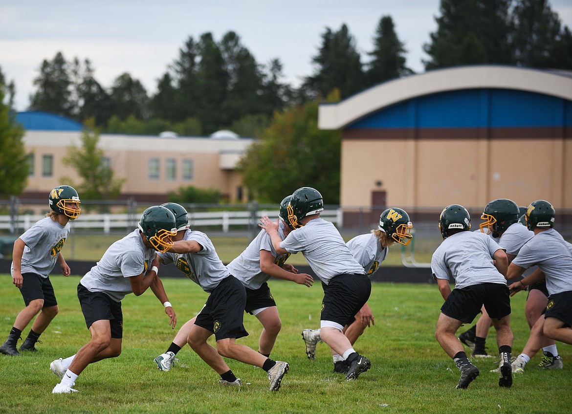 The Bulldogs football team gets in a blocking drill during the first day of practice on Friday, Aug. 16. (Daniel McKay/Whitefish Pilot)