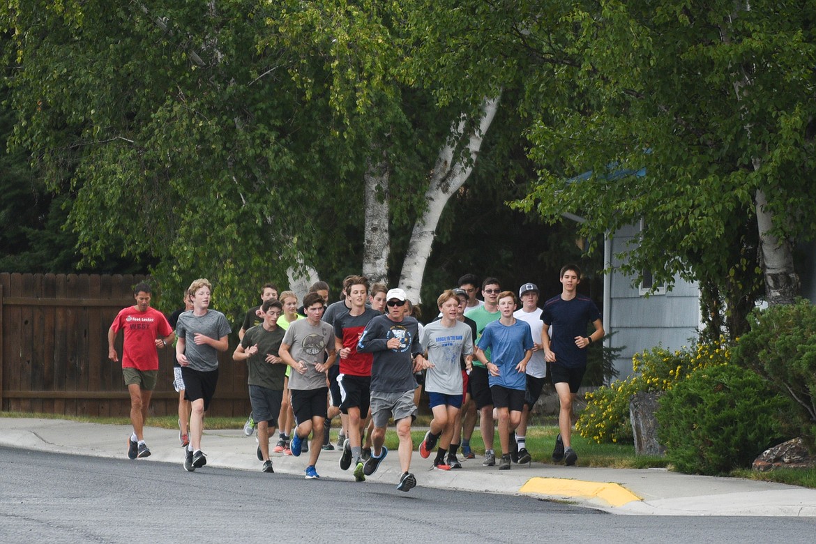 The Whitefish cross country team took to the streets on Friday, Aug. 16. (Daniel McKay/Whitefish Pilot)