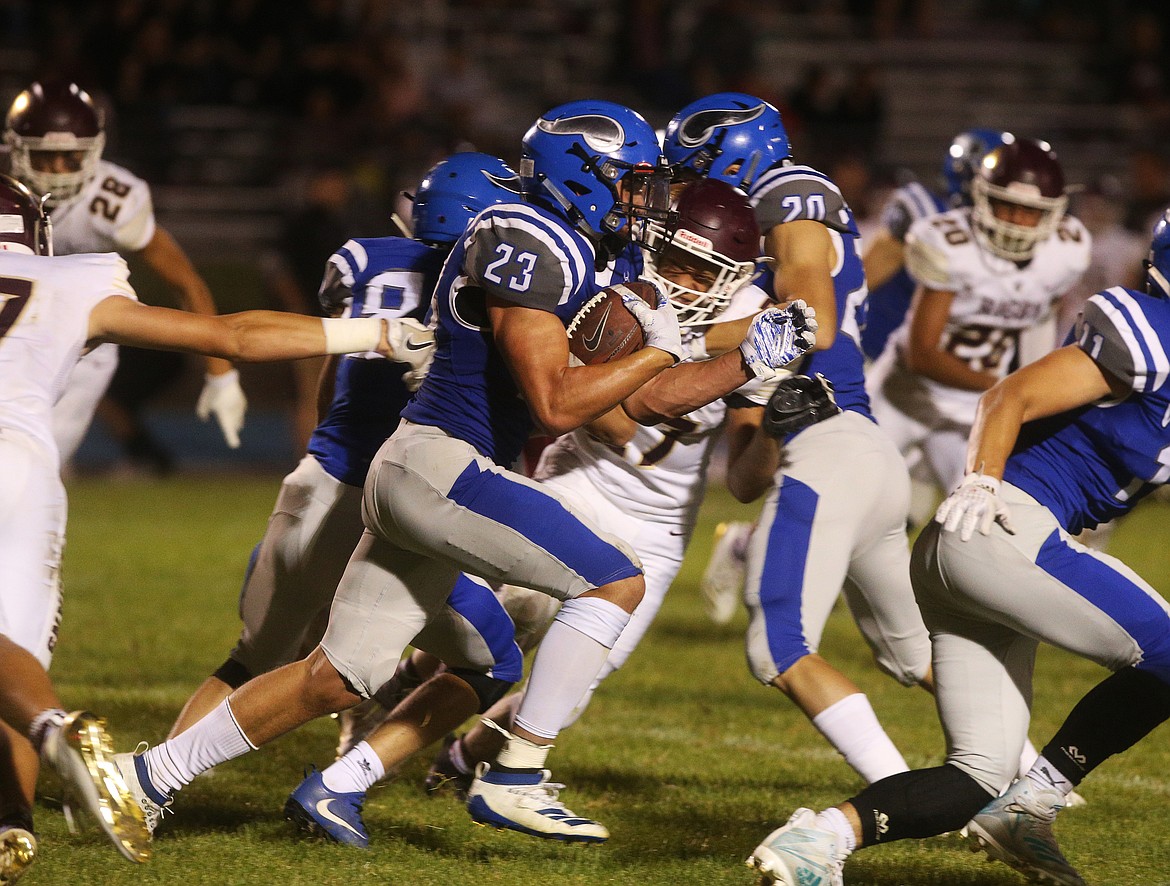 Coeur d'Alene High running back Gunner Giulio runs up field against the Rigby Trojans during Friday night's game at CHS. (LOREN BENOIT/Press)