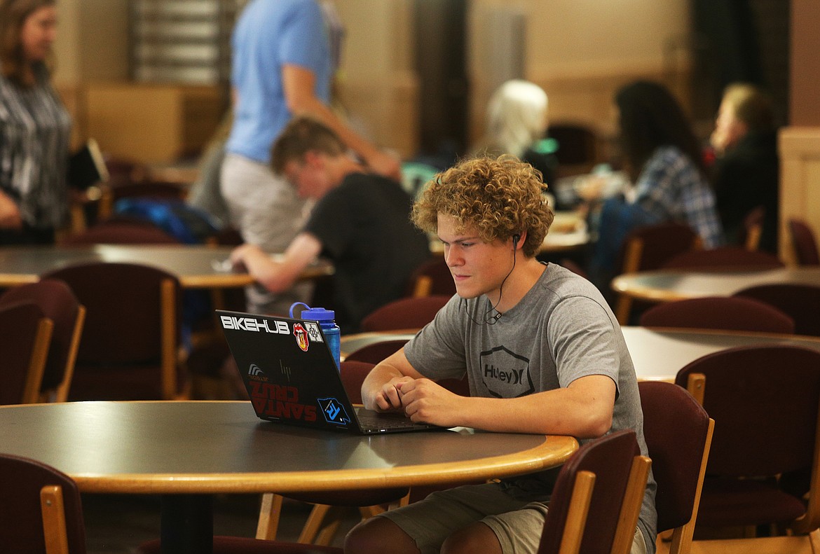 LOREN BENOIT/Press
North Idaho College freshman Ty Bennett studies his entrepreneurship 101 class homework Thursday in North Idaho College&#146;s Student Union Building. According to an Idaho Center for Fiscal Policy report, state funding for higher education is down and the cost of college is up in Idaho.