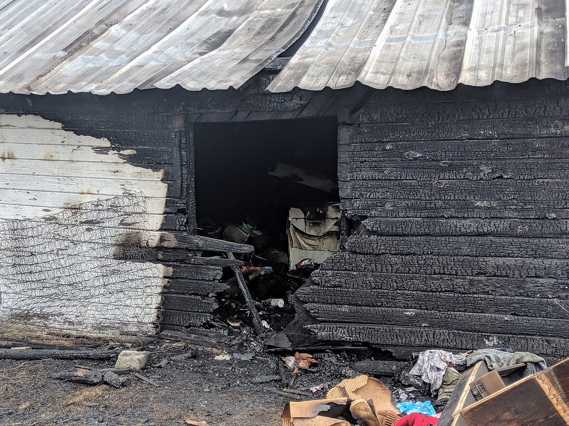 The area believed to be the point of origin on the southern wall of the garage. Burn patterns show that the fire started outside, then worked its way inside.