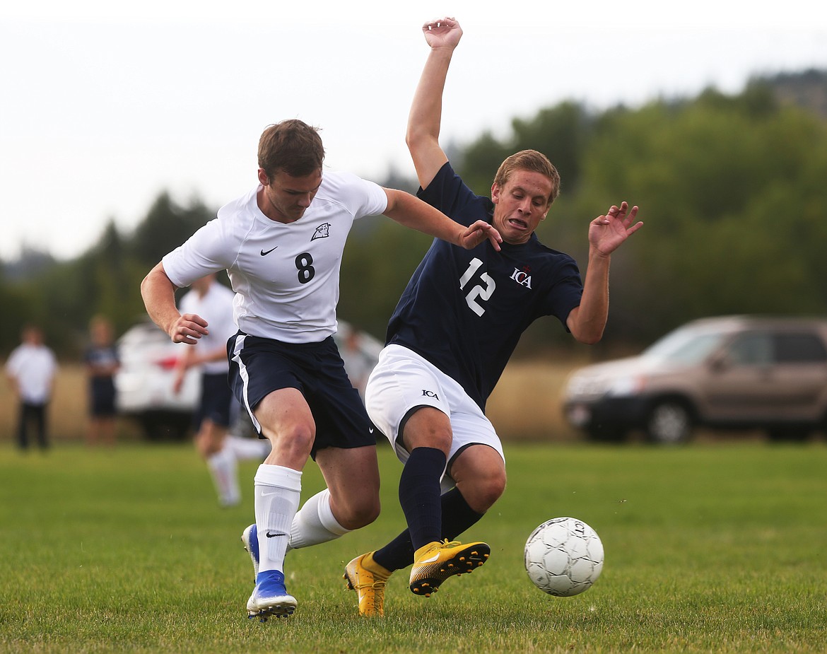 Coeur d&#146;Alene Charter&#146;s Dennis Klien, left, and Immaculate Conception&#146;s Sebastian Eloe fight for the ball in a match Tuesday at Bodine Field in Post Falls.