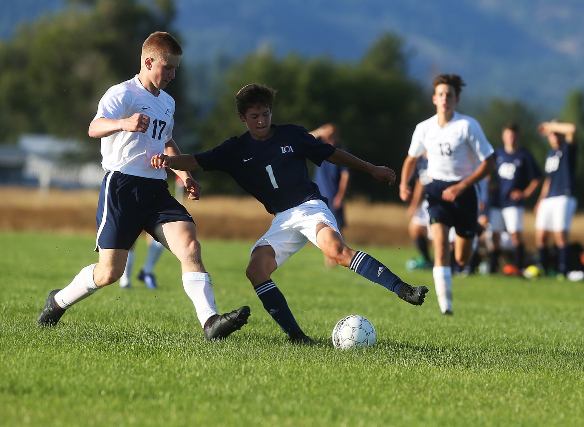 Immaculate Conception&#146;s Marcellinus Melnick (1) pivots the ball around Coeur d&#146;Alene Charter defender Taylor Hanock in a match Tuesday at Bodine Field in Post Falls.