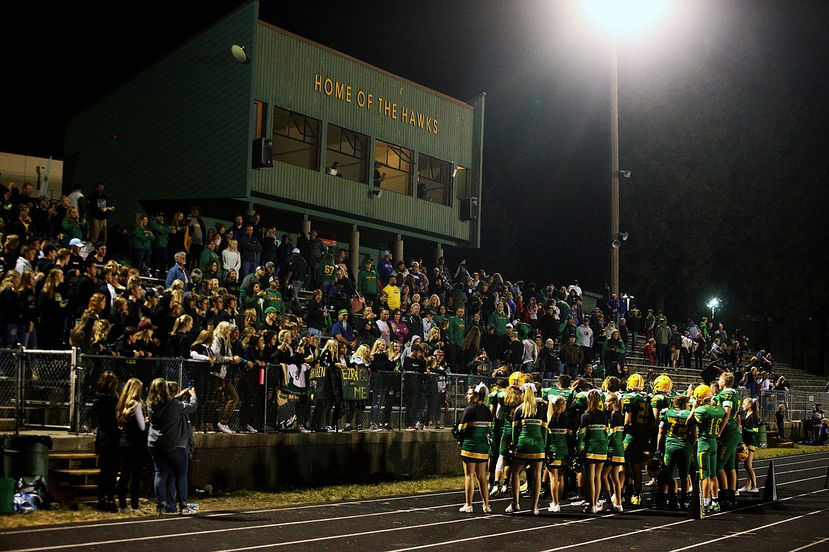 The Lakeland High School football team gathers near the crowd to sing the fight song after defeating Rogers.